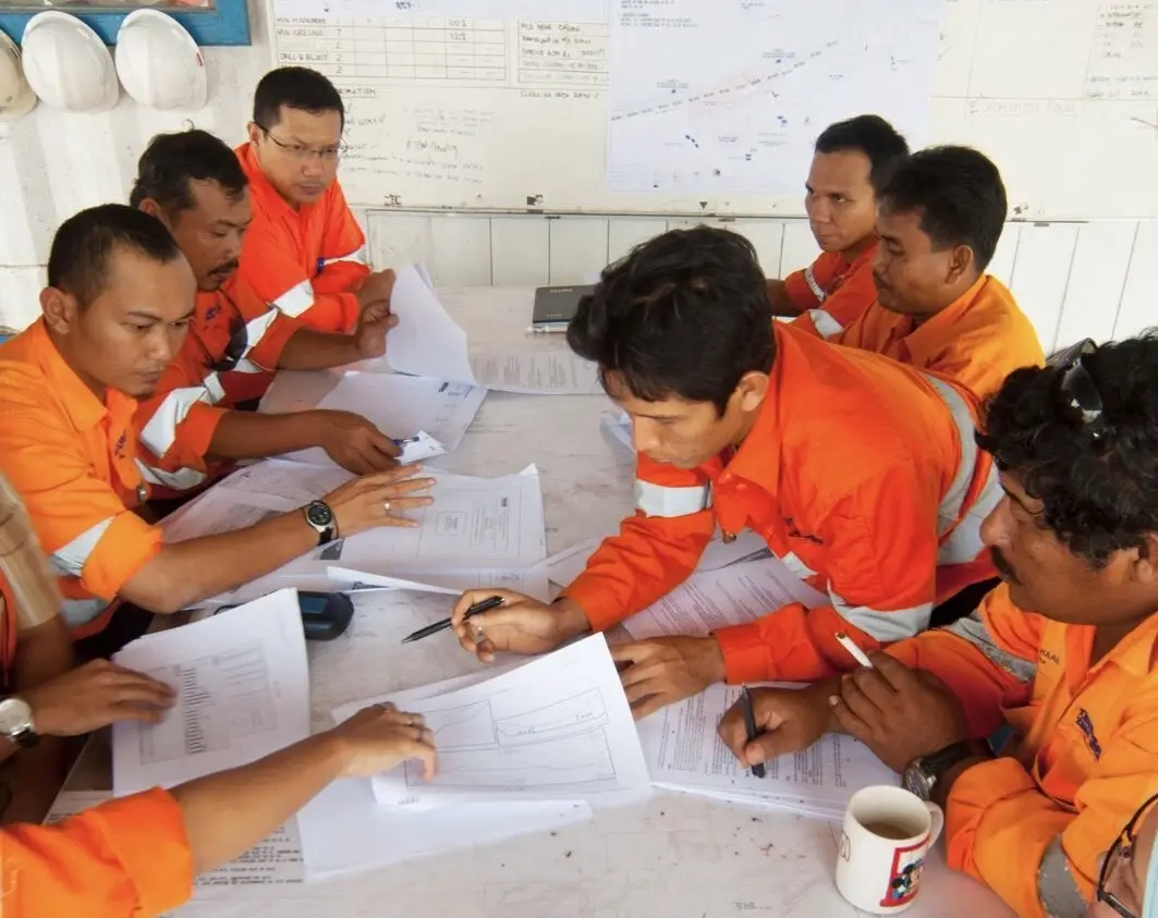 Mining professionals planning together